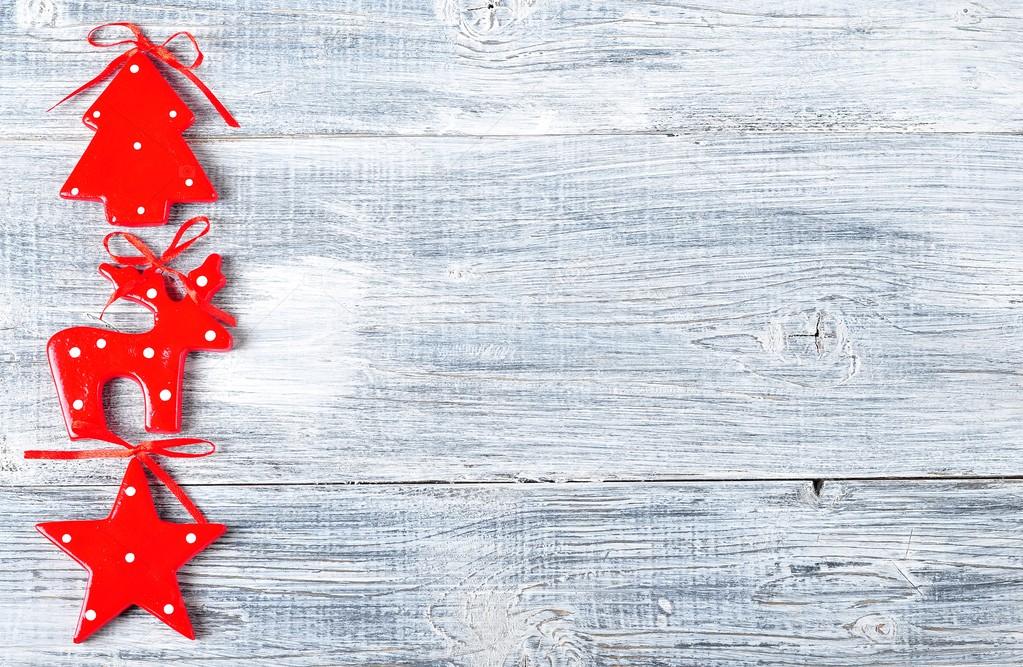 Christmas, New Year background red star, spruce tree, sledge on a grey wooden table