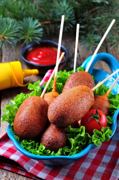 Sausage on a skewer in a corn dough deep fried, homemade corn dogs — Stock Photo, Image