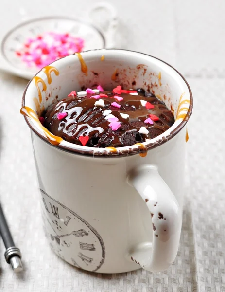 Delicious Mug Cake, Chocolate cake cooked in a cup in the microwave