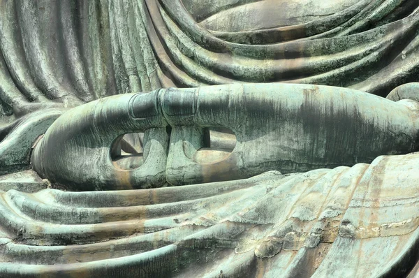 The Great Buddha (Daibutsu)'s hands in Japan by making circles w — Stock Photo, Image