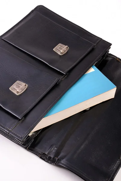 Book in black schoolbag — Stock Photo, Image