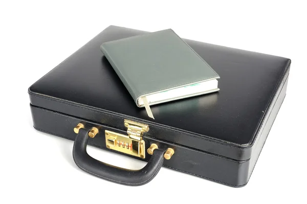 Black business leather Briefcase with book — Stock Photo, Image