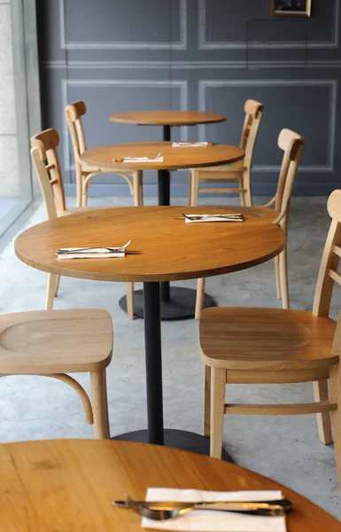 Wooden chair and table in the corner of cafe — Stock Photo, Image