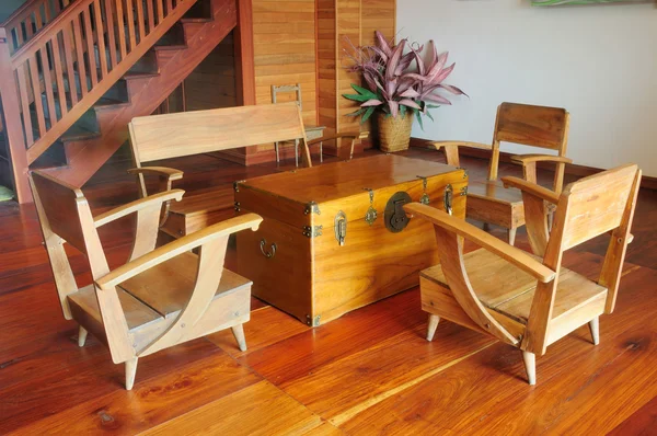 A teak wood console table and armchair on wooden floor — Stock Photo, Image