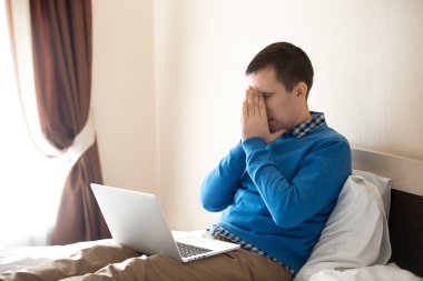 Young man frustrated with work