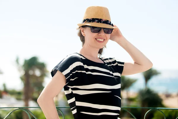 Young woman on the balcony in tropics — Stock Photo, Image