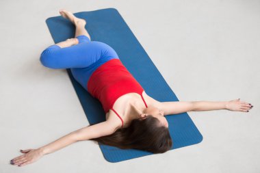 Yoga Indoors: Revolved Abdomen Pose clipart