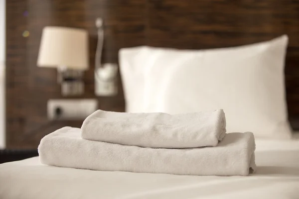 Stack of towels on the bed — Stock Photo, Image