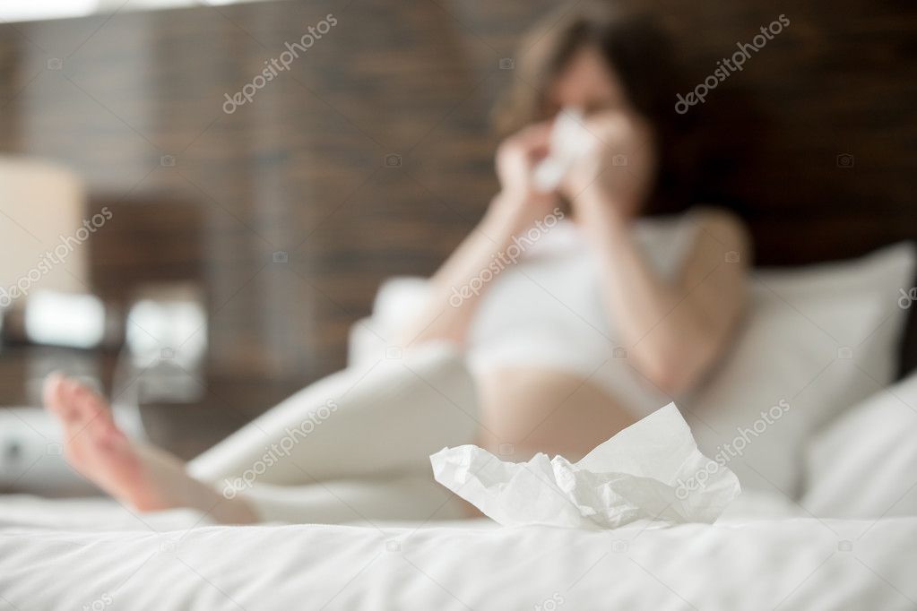 Young pregnant woman caught cold Stock Photo by ©fizkes 106981756