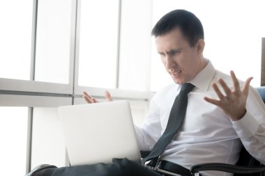 Young business man in stressful situation