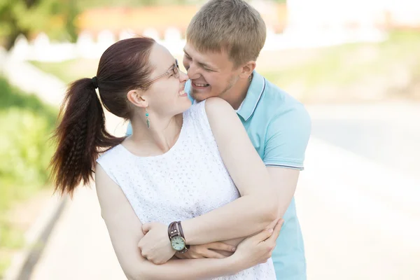 Lovers hugging and laughing on the street — Stock Photo, Image