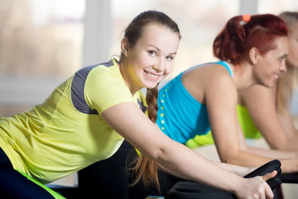 Portrait of cyclist woman in gym — Stock Photo, Image