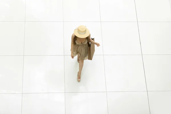 Woman walking in shopping centre. View from above — Zdjęcie stockowe