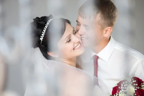 Wedding couple laughing and cuddling — Stock Photo, Image