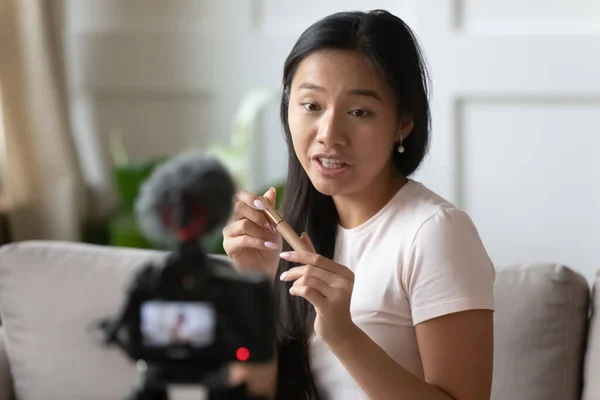 Close up young Asian woman shooting cosmetics review video — Stock Photo, Image