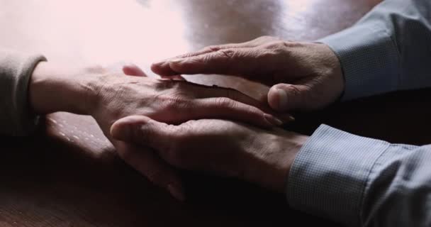 Closeup view husband holding and stroking wife hand — Stock Video