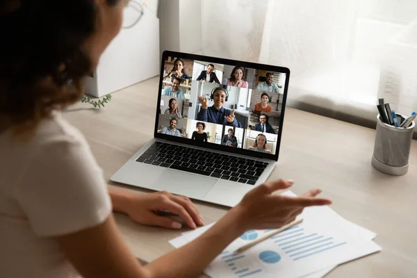 Woman worker speak on group video call on computer