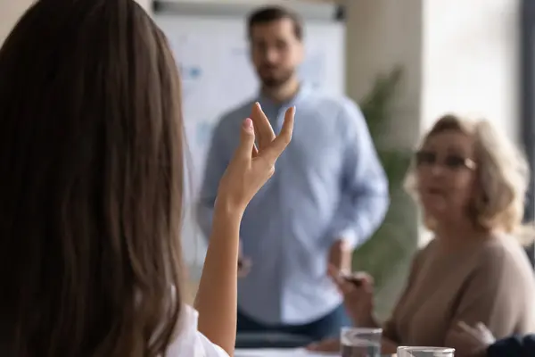 Close up of female employee ask question at meeting — Stock Photo, Image