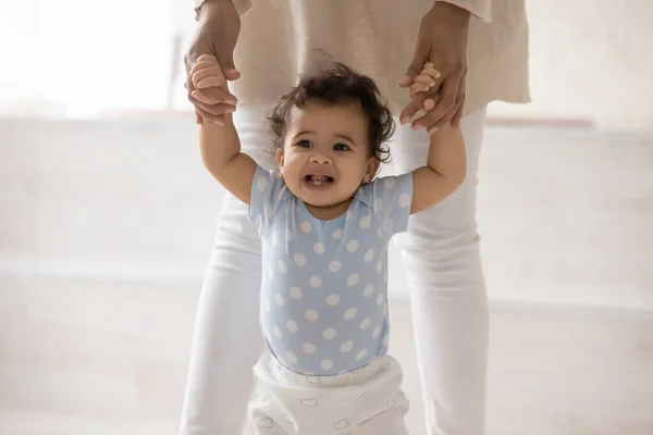Small biracial baby toddler make first steps — Stock Photo, Image