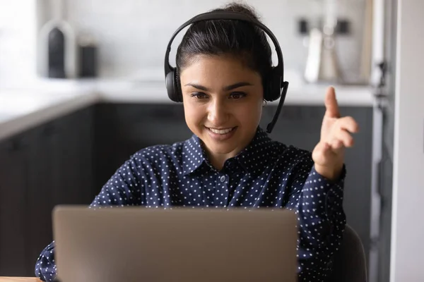 Smiling Indian woman in headphones talk on video call — Stock Photo, Image