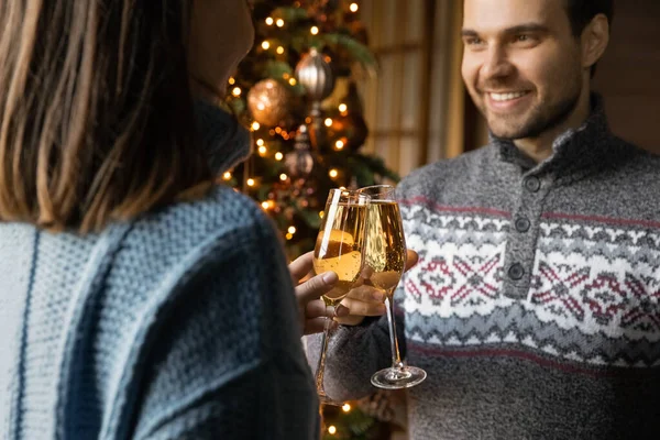 Happy couple clink bottles celebrating New Year — Stock Photo, Image