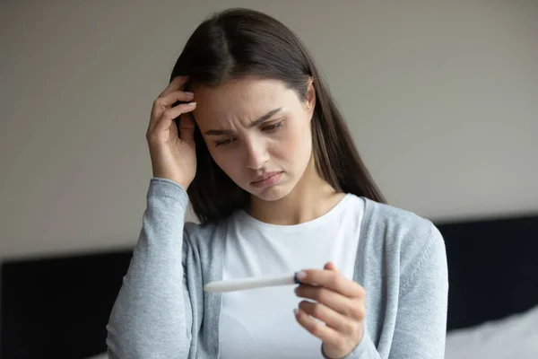 Sad woman getting negative result of pregnancy test after ivf — Stock Photo, Image
