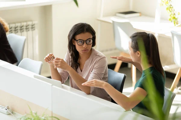 Two diverse women office workers brainstorming choosing correct marketing strategy — Stock Photo, Image