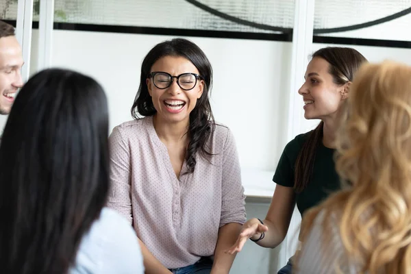 Diverse multiethnic corporate staff laughing on good joke on briefing