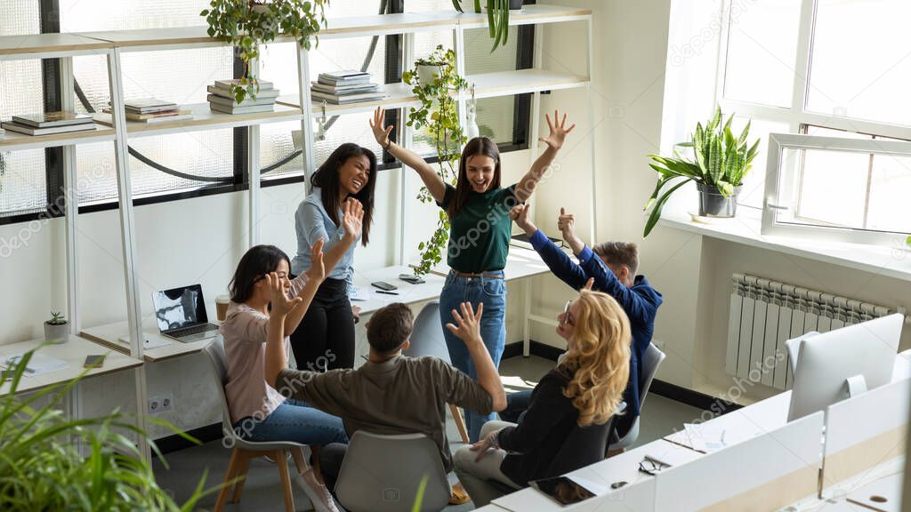 Happy excited diverse teammates friends having fun meeting in office