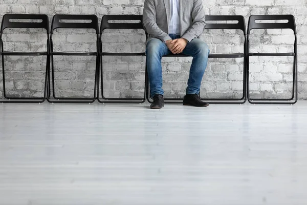 Cropped shot of young male patient expecting for doctor appointment — Stock Photo, Image