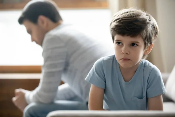 Close up upset little boy and father after quarrel — Stock Photo, Image