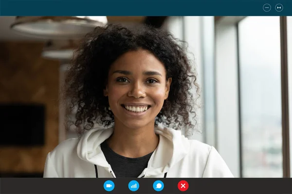 Pretty young african american biracial woman holding video call.