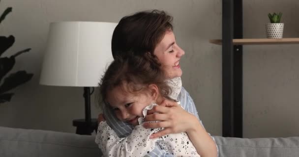 Cute little girl embrace young happy mother — Stock Video