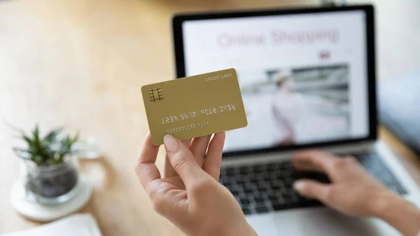 Close up of woman shop on laptop at home