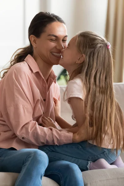 Mother and daughter touch noses enjoy tender time together indoor — Stock Photo, Image