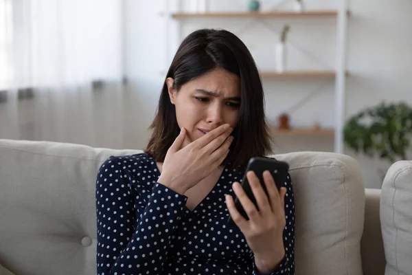 Close up stressed frustrated Asian woman looking at phone screen — Stock Photo, Image