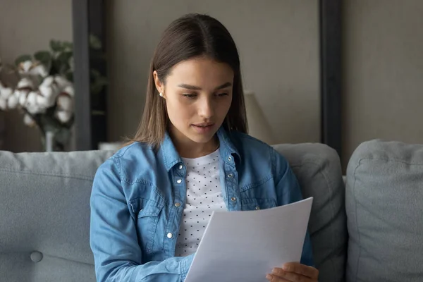 Young Caucasian woman read paper document at home — Stock Photo, Image