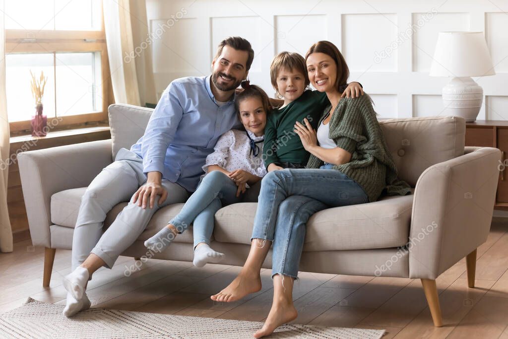 Portrait of happy family with kids relax at home