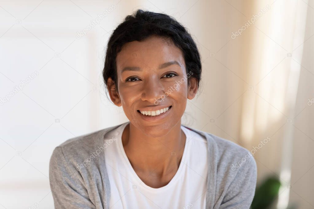 Headshot portrait of happy African American woman
