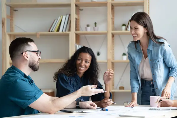 Smiling multiracial colleagues have fun working at meeting — Stockfoto