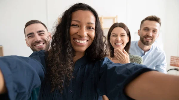 Wide view of happy colleagues make selfie in office — Stockfoto