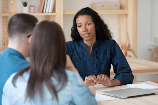 Biracial female consultant have meeting with couple clients — Stockfoto