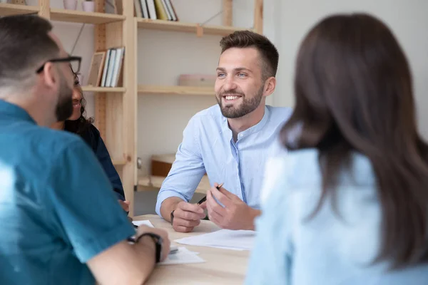 Smiling multiracial colleagues have meeting in office — Stockfoto