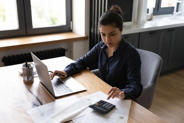 Busy millennial indian woman professional accountant preparing annual financial report — Stockfoto