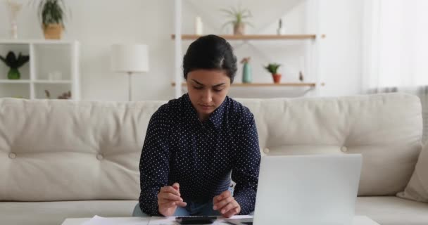 Indian woman calculates personal finances feels upset about overspend — Stock Video