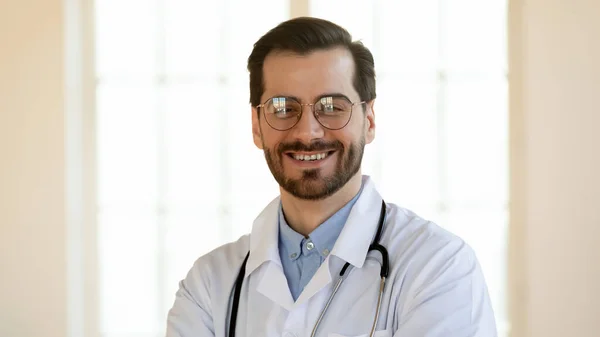 Banner view portrait of smiling male doctor in whites