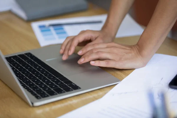 Close up of young woman designer hands using laptop keyboard — Stock fotografie