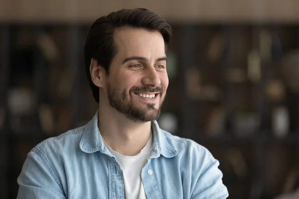 Smiling young man look in distance dreaming — Stock Photo, Image