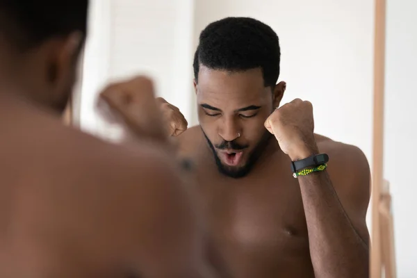 Young bare african ethnicity man tuning on positive mood. — Stock Photo, Image