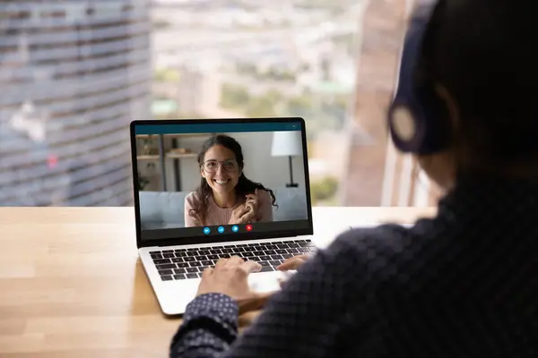 Back view of woman talk on video call with colleague — Stock Photo, Image